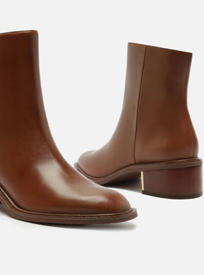 BOTA COURO CANO MÉDIO BLOCO METAL
